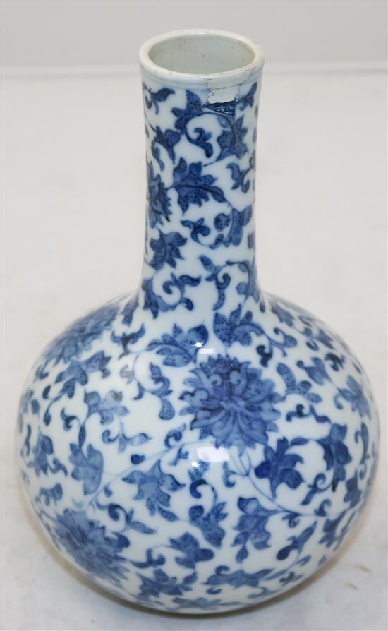 A Chinese blue and white lotus bottle vase, Yongzheng mark, 19th century, 21cm, neck restored